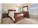 Cozy bedroom with a queen bed, matching dresser, and natural light at 4211 Wingfoot Ct, Decatur, GA 30035