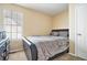Simple bedroom with a black leather bed, neutral carpet, and a chest of drawers at 4211 Wingfoot Ct, Decatur, GA 30035