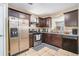 Well-equipped kitchen with stainless steel appliances, granite countertops, and ample cabinetry at 4211 Wingfoot Ct, Decatur, GA 30035