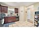 Traditional kitchen featuring tile floors, dark wood cabinets, and granite countertops at 4211 Wingfoot Ct, Decatur, GA 30035