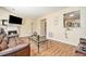 Spacious living room with hardwood floors, fireplace, and view of kitchen at 4211 Wingfoot Ct, Decatur, GA 30035