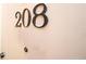 Apartment door with unit number 208 on a white wall at 351 Washington Ne Ave # 208, Marietta, GA 30060