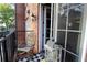 Balcony with rocking chair and exterior brick offers charming outdoor appeal at 351 Washington Ne Ave # 208, Marietta, GA 30060