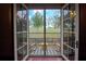 Inviting balcony with rocking chairs overlooks a peaceful cemetery view at 351 Washington Ne Ave # 208, Marietta, GA 30060
