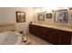 Modern bathroom with double sinks and a large soaking tub at 351 Washington Ne Ave # 208, Marietta, GA 30060