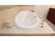 A close up of the bathroom jacuzzi tub and fixtures at 351 Washington Ne Ave # 208, Marietta, GA 30060