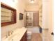 Bathroom with wooden vanity, framed mirror, and tub/shower combo at 351 Washington Ne Ave # 208, Marietta, GA 30060