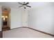 Bedroom featuring plush carpet, large window and ceiling fan at 351 Washington Ne Ave # 208, Marietta, GA 30060
