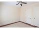 Bedroom with carpet, two white doors, and a ceiling fan at 351 Washington Ne Ave # 208, Marietta, GA 30060