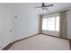 Bright bedroom featuring plush carpet, large window and ceiling fan at 351 Washington Ne Ave # 208, Marietta, GA 30060