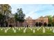Apartment building exterior is centered on a lawn with headstones at 351 Washington Ne Ave # 208, Marietta, GA 30060
