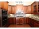 Modern kitchen with stainless steel appliances, custom cabinets, and stylish backsplash at 351 Washington Ne Ave # 208, Marietta, GA 30060