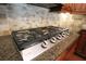 Close-up of the kitchen stovetop and backsplash at 351 Washington Ne Ave # 208, Marietta, GA 30060