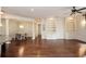 Open concept living room with dining area, hardwood floors, and custom built-in features at 351 Washington Ne Ave # 208, Marietta, GA 30060