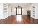 Spacious living room featuring hardwood floors, custom bookshelves, and a fireplace at 351 Washington Ne Ave # 208, Marietta, GA 30060