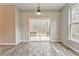 Spacious dining area with sliding glass doors and large window at 700 Brambling Way, Stockbridge, GA 30281