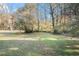 Large grassy backyard with mature trees at 3212 Ward Sw Dr, Atlanta, GA 30354