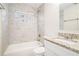 Clean bathroom with granite countertop, white cabinets, and tiled shower/tub at 3212 Ward Sw Dr, Atlanta, GA 30354