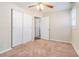 Bedroom with ceiling fan, closet, and door to hallway at 3212 Ward Sw Dr, Atlanta, GA 30354