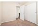 Bedroom with carpet, door to bathroom and sliding door to closet at 3212 Ward Sw Dr, Atlanta, GA 30354