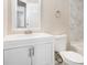 Updated bathroom with white vanity, toilet and bathtub at 5063 S Woodbridge Trl, Stone Mountain, GA 30088