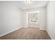 Well-lit bedroom with new carpet and a large window at 5063 S Woodbridge Trl, Stone Mountain, GA 30088