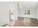 Bright dining area with hardwood floors and kitchen access at 5063 S Woodbridge Trl, Stone Mountain, GA 30088