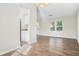 Bright dining area with hardwood floors and kitchen access at 5063 S Woodbridge Trl, Stone Mountain, GA 30088