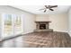 Living room with a stone fireplace and hardwood floors at 5063 S Woodbridge Trl, Stone Mountain, GA 30088