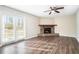 Living room with stone fireplace and hardwood floors at 5063 S Woodbridge Trl, Stone Mountain, GA 30088