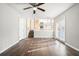 Spacious living room with hardwood floors and access to a deck at 5063 S Woodbridge Trl, Stone Mountain, GA 30088