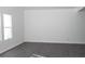 Spacious basement with dark gray vinyl flooring and neutral walls at 2655 Brandenberry Dr, Decatur, GA 30034