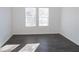Well-lit bedroom featuring vinyl flooring and dual windows at 2655 Brandenberry Dr, Decatur, GA 30034