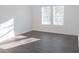 Spacious bedroom with vinyl flooring and two windows at 2655 Brandenberry Dr, Decatur, GA 30034