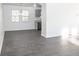 Spacious dining area with gray vinyl plank flooring and modern light fixture at 2655 Brandenberry Dr, Decatur, GA 30034