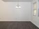 Spacious dining area with gray vinyl plank flooring and modern light fixture at 2655 Brandenberry Dr, Decatur, GA 30034