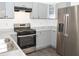 Modern kitchen with gray cabinets, stainless steel appliances, and granite countertops at 2655 Brandenberry Dr, Decatur, GA 30034