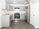 Updated kitchen featuring gray cabinets and stainless steel appliances at 2655 Brandenberry Dr, Decatur, GA 30034