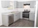 Modern kitchen with gray cabinets, stainless steel appliances and dishwasher at 2655 Brandenberry Dr, Decatur, GA 30034