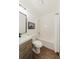 Bathroom features a vanity, toilet, shower-tub, and modern lighting at 147 Bowen Sw Cir, Atlanta, GA 30315