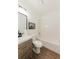 A bathroom features a vanity, toilet, tub-shower, and elegant decor at 147 Bowen Sw Cir, Atlanta, GA 30315