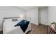 Bedroom features a bed with a blue throw, closet, and side table at 147 Bowen Sw Cir, Atlanta, GA 30315