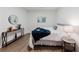Cozy bedroom featuring bedside table, accent table, and decorative wall art at 147 Bowen Sw Cir, Atlanta, GA 30315