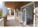 Exterior view of a covered front porch with brick supports and entranceway at 147 Bowen Sw Cir, Atlanta, GA 30315