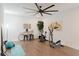 Well-lit home gym featuring exercise equipment, wood floors, and modern decor at 147 Bowen Sw Cir, Atlanta, GA 30315