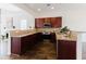 Well-equipped kitchen with granite countertops, stainless steel appliances, and cherry wood cabinets at 147 Bowen Sw Cir, Atlanta, GA 30315