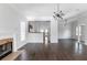 Spacious open-concept living room with hardwood floors, fireplace, and modern lighting at 147 Bowen Sw Cir, Atlanta, GA 30315