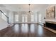 Spacious living room with hardwood floors, modern lighting, and fireplace feature at 147 Bowen Sw Cir, Atlanta, GA 30315