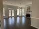 Bright living room featuring hardwood floors, a fireplace, and French doors leading to a deck at 147 Bowen Sw Cir, Atlanta, GA 30315