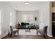 Cozy living room with a gray couch, hardwood floors, and plenty of natural light at 147 Bowen Sw Cir, Atlanta, GA 30315
